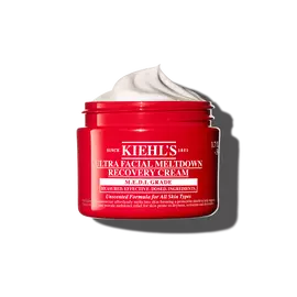 Червен буркан Kiehl’s Ultra Facial Meltdown Recovery Cream Whip, показващ текстура на бита сметана.