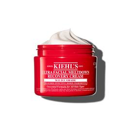 Червен буркан Kiehl’s Ultra Facial Meltdown Recovery Cream Whip, показващ текстура на бита сметана.
