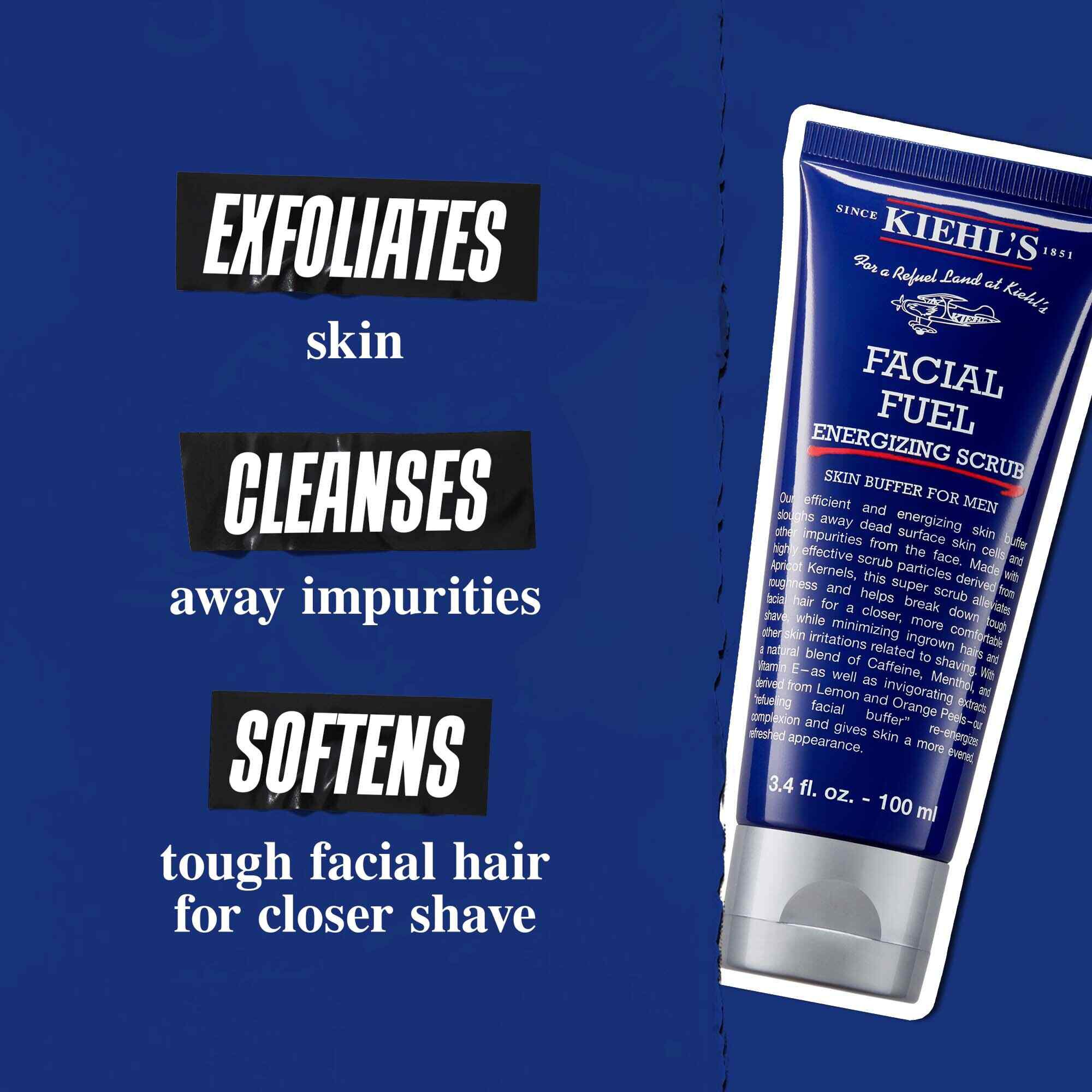 Туба на Facial Fuel Energizing Scrub на тъмносин фон. Текстът гласи: „Ексфолира кожата, почиства замърсяванията и омекотява твърдата брада за по-гладко бръснене.“