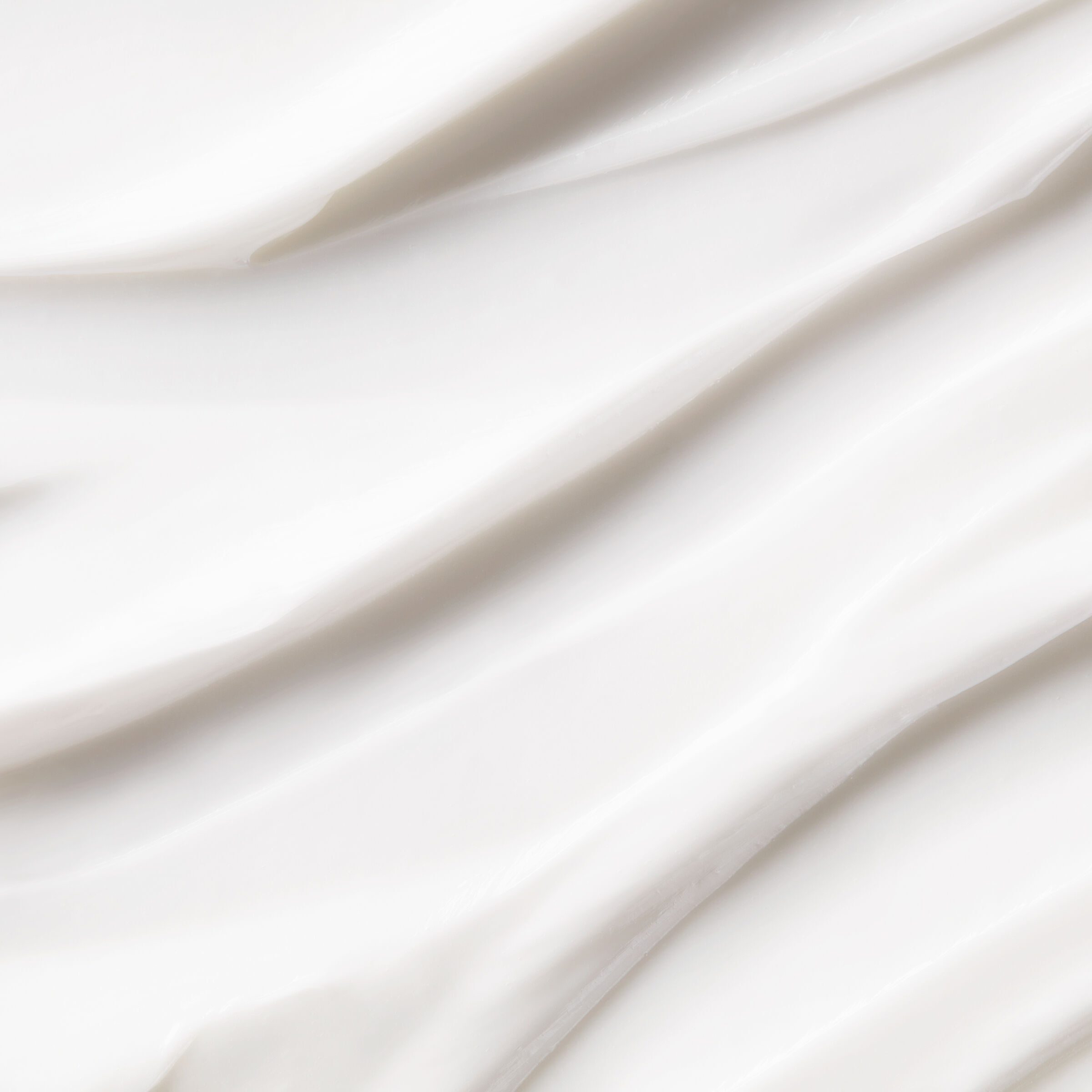 A graphic featuring a text box that reads "HELPS NOURISH scalp to create an ideal environment for healthy-looking hair" on the left, and a white jar of Kiehl's Amino Acid Scalp Moisture-Restoring Treatment Mask on the right. 