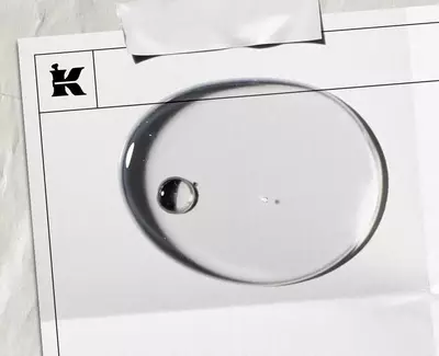 Close-up of test tubes filled with bright blue liquid, arranged in a rack with a soft focus on the background.