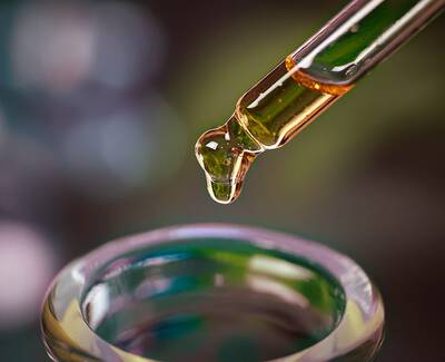 A close-up of a variety of roasted coffee beans, showcasing their rich brown color and textured surfaces.