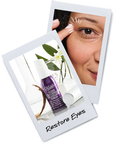 A close-up of a woman applying Kiehl's eye serum, with the product prominently displayed beside her. Text reads 'Restore Eyes.'